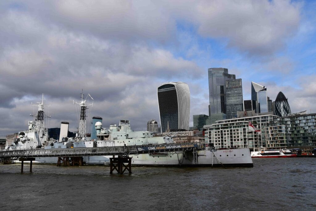 Exploring Historic HMS Belfast in London 2026 Never published photography shows the view on The City Of London and HMS Belfast and The Gherkin building and Walkie Talkie
